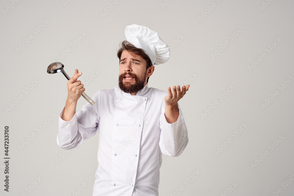 male chef with a saucepan in his hands professional work kitchen lifestyle male chef with a saucepan in his hands professional work kitchen lifestyle