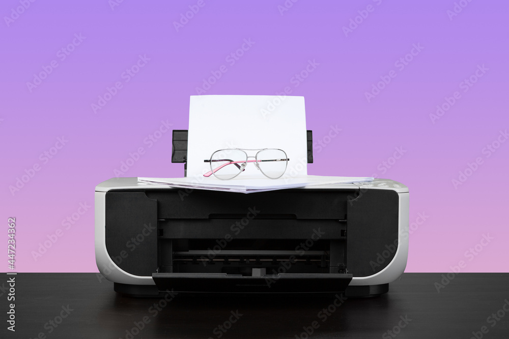 Home laser printer on desk against purple background Stock Photo | Adobe  Stock