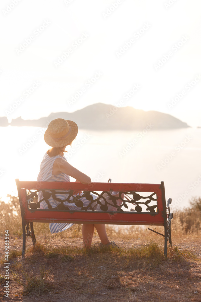 girl tourist sitting on a bench at the observation deck girl tourist sitting on a bench at the observation deck