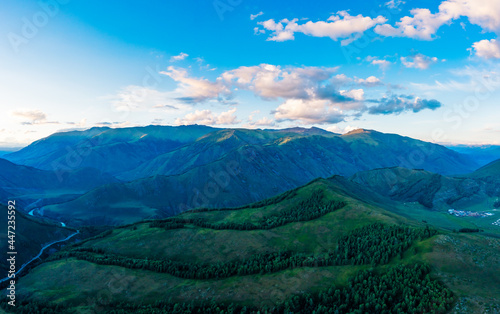 Aerial View of mountain and green forest at sunset in Xinjiang China.