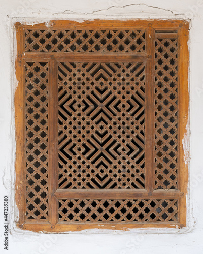 Traditional wooden geometric latticework with islamic pattern at Sar-i-Mazor mosque, Istaravshan, Tajikistan photo