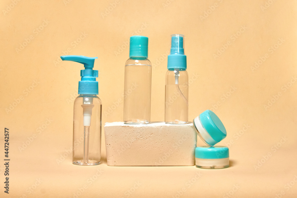 Cosmetics container on the pastel background. Earth colors, zero waste containers. Mockup concept. Minimal boxes and geometric podium. Scene with geometrical forms. 
