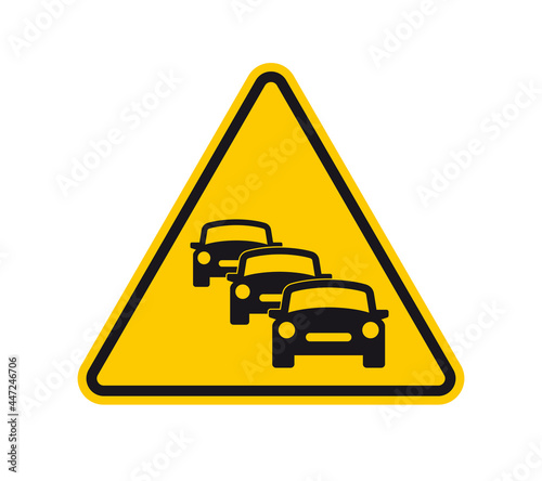 Vector yellow triangle sign - black silhouette column of cars. Isolated on white background.