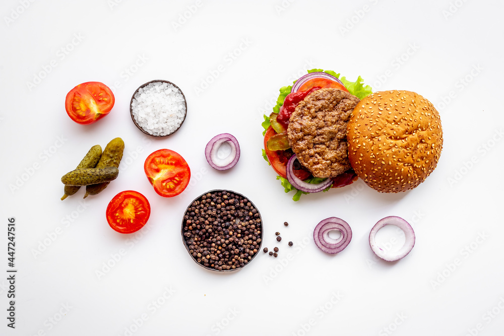 Hamburgers with vegetales and french fries. Top view