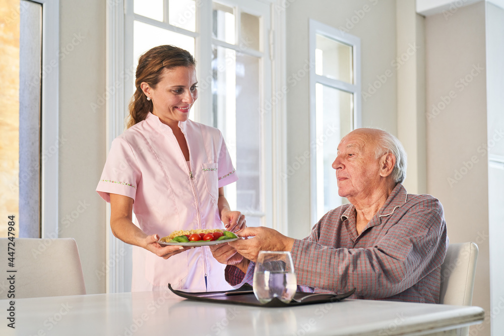 Senior is provided with lunch by the delivery service Senior is provided with lunch by the delivery service
