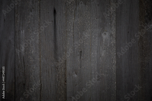 Black wooden background with old painted boards