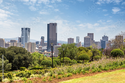 Pretoria cityscape across the parklands of the Union Buildings. Pretoria is one of South Africa's three capital cities and is the administrative capital. photo