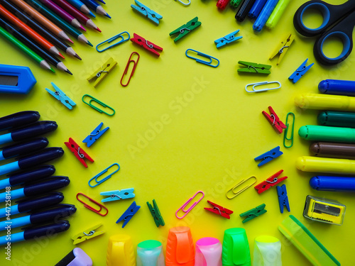 School office supplies on a yellow background. Preparation for school. Education concept.