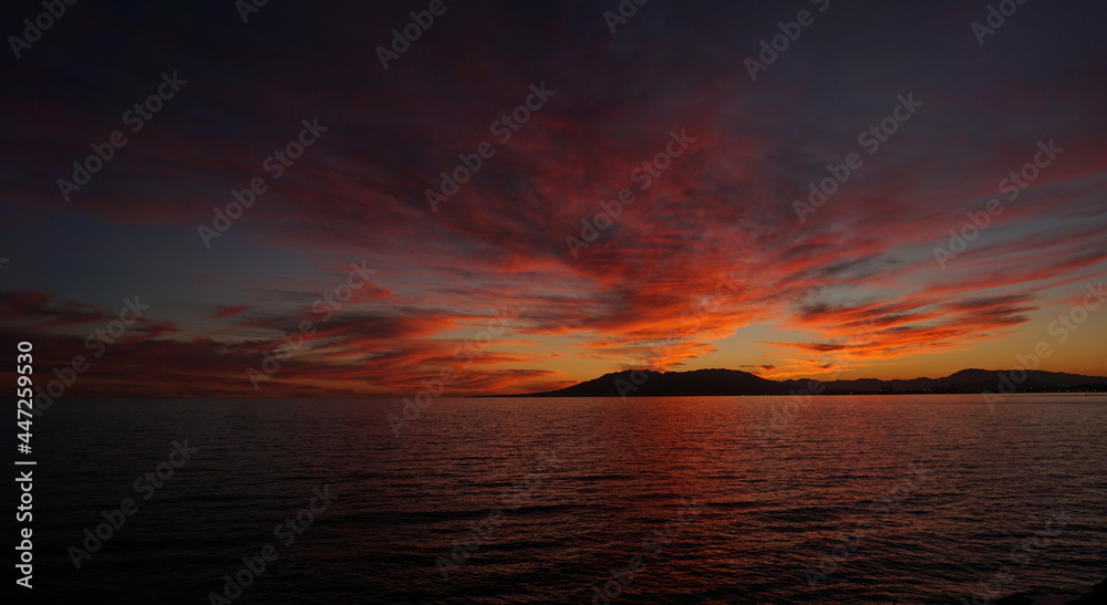 Sunset on the sea with mountain view