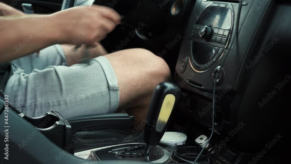 man starts the car and switches the gearbox man starts the car and switches the gearbox