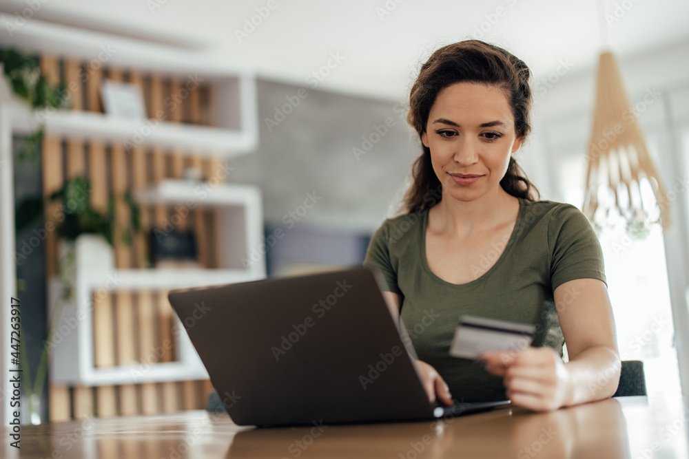Young woman, making sure her credit card is working. Young woman, making sure her credit card is working.