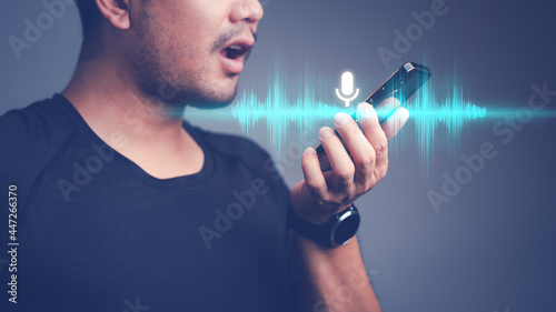 Canvas Print man using voice assistant on smartphone, talking to smartphone for Access to information and applications, Write a message and send a message