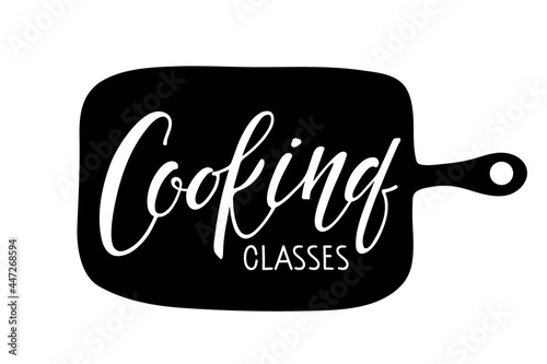 Cooking classes handwritten lettering on cutting board. School of Cooking logo template. Poster for food studio, online master class, cooking courses, culinary school. Black white vector illustration