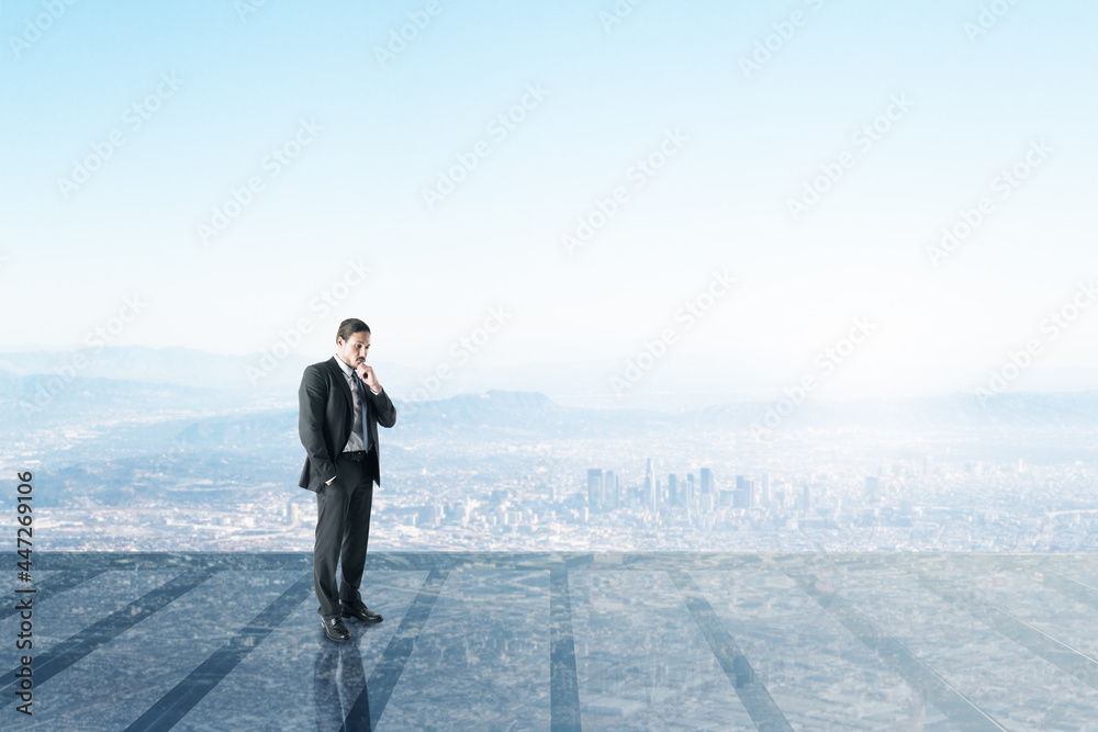 Businessman on glass balcony looking into the distance at city with mock up place. Success and future concept. Businessman on glass balcony looking into the distance at city with mock up place. Success and future concept.