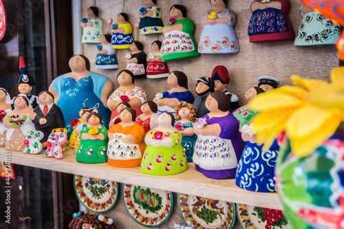 Traditional souvenirs of Otranto, Apulia, Italy. Colorful ceramic figures of women. Gifts from Puglia