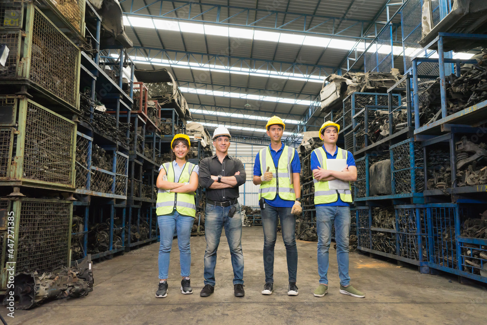 Man and woman work together, diversity of full body of Caucasian and Asian engineer worker men and woman stand and crossed arms  in factory-warehouse