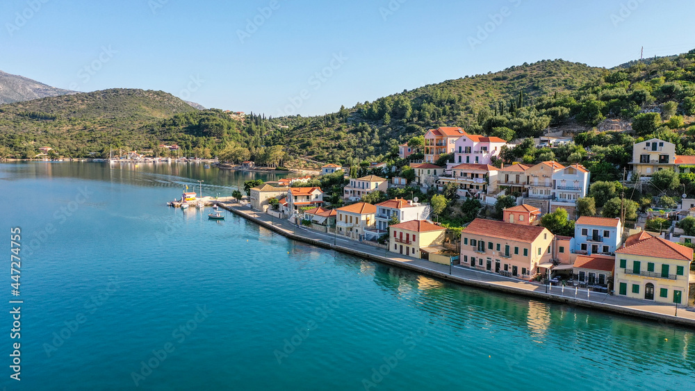 Aerial shot of the south side of the seaside of capital town Vathy in Ithaca with colorful traditional Greek houses