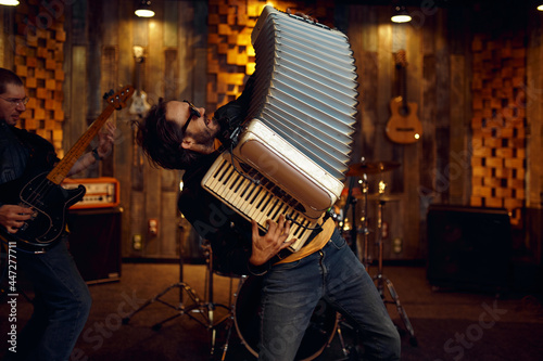 Two musicians with accordion and electric guitar photo