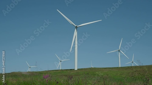Wallpaper Mural Wind Farm Turbines turning against blue sky Torontodigital.ca