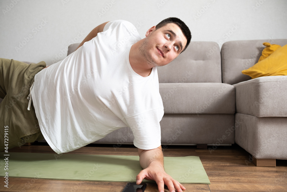 Young man doing exercises at home Young man doing exercises at home