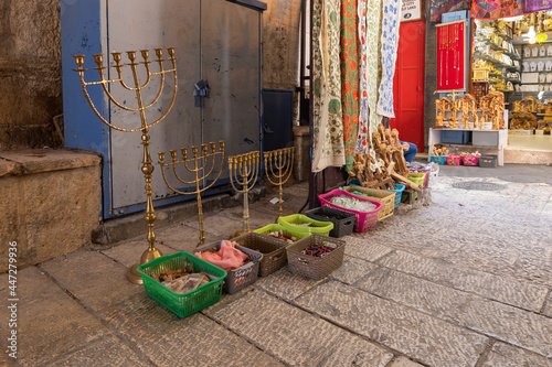 Souvenirs and decorations are sold at the souvenir street shop on Muristan street in the Christian quarter in the old city of Jerusalem, Israel photo