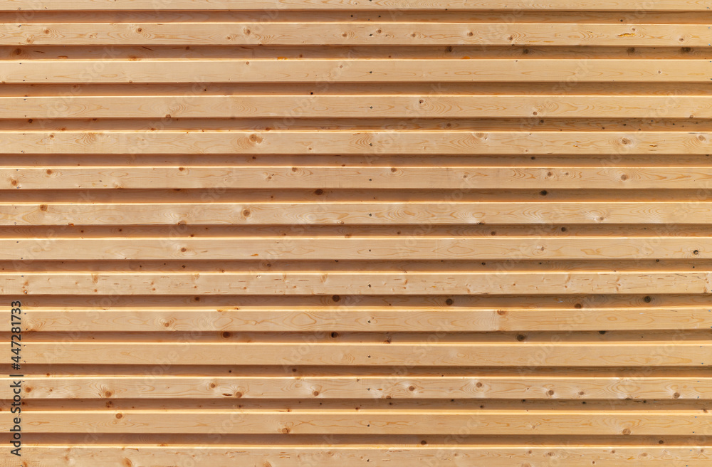 volume surface (wall) made of horizontal wooden boards of natural color for the background volume surface (wall) made of horizontal wooden boards of natural color for the background