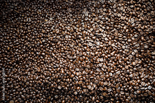 Close up of roasted coffee beans background abstract .