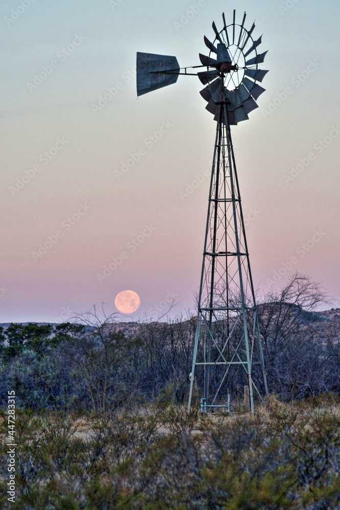 Windmill and moonset near Sanderson Texas