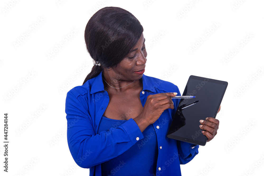 beautiful mature business woman pointing a pen on the screen of the digital tablet. beautiful mature business woman pointing a pen on the screen of the digital tablet.
