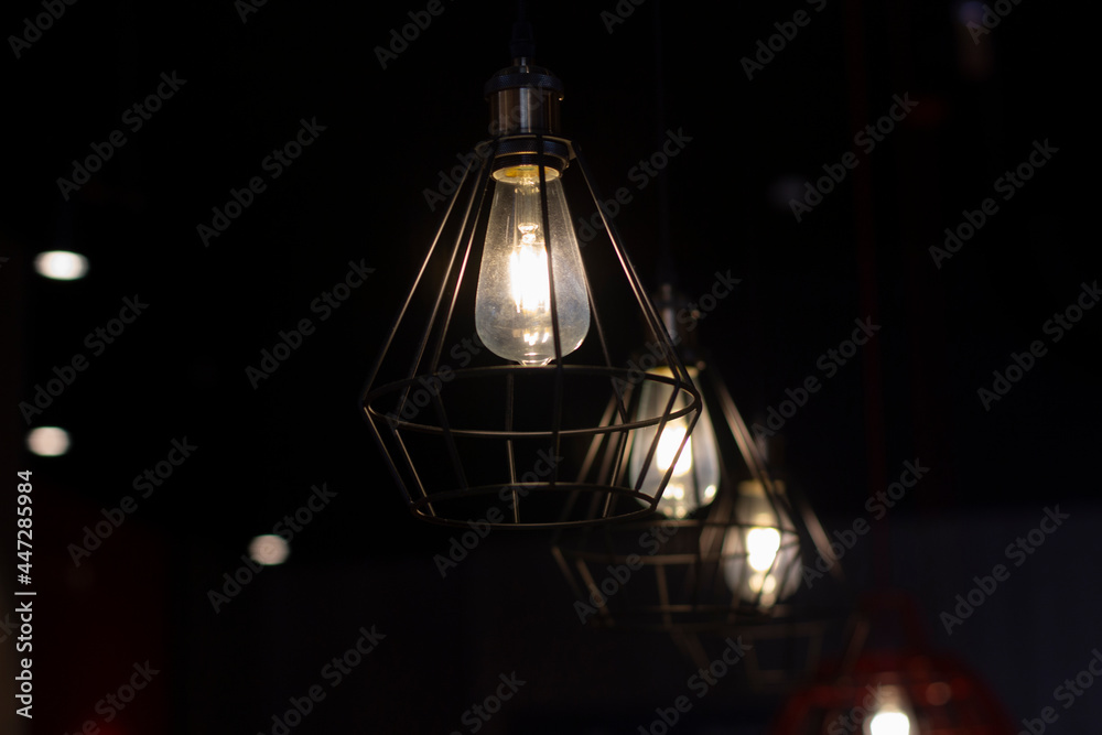 Stylish lamps hang in the dark. Stylish lamps hang in the dark.