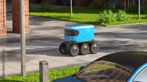 Autonomous delivery robot drives along the street