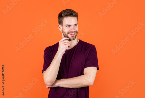 having pleasant smile. happy guy on orange background. cheerful man looking so trendy and stylish.