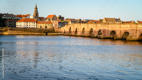 Berwick's Old Bridge and Town hall Spire. Berwick upon Tweed is the most northerly town in England and is located in Northumberland at the mouth of the River Tweed just below the Scottish border