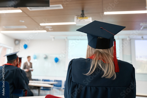female graduate in cap and gown