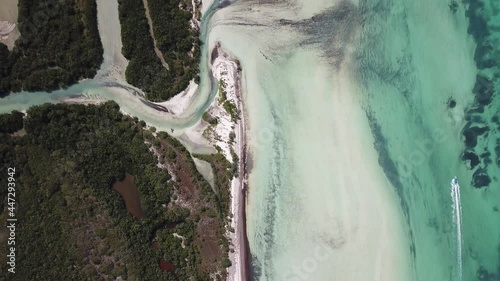 DLOG Flat Aerial Drone view of Holbox tropical island in Mexico. White sand beach and clear blue sea water. Paradise vacation concept.