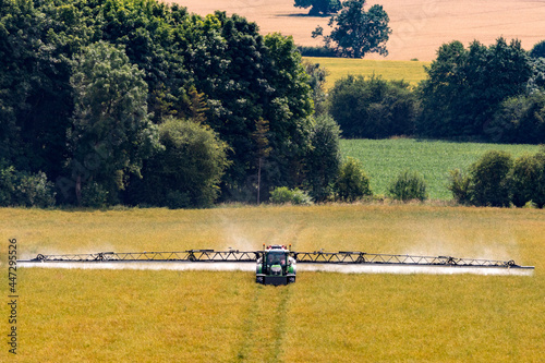 Obraz na plátně Agriculture - A farmer spraying pesticide on his crops in North Yorkshire, England