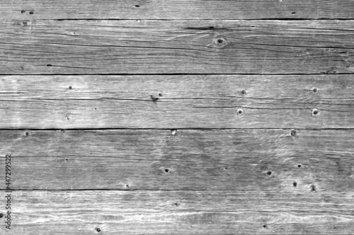 Part of wooden house wall in black and white.