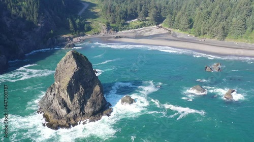 The Pacific Ocean washes against the scenic yet rugged coastline of southern Oregon. This beautiful region of the Pacific Northwest is accessible via highway 101. photo