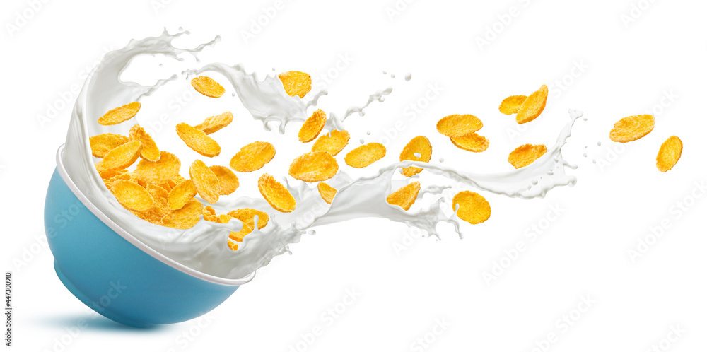 Bowl of corn flakes with milk splash isolated on white background