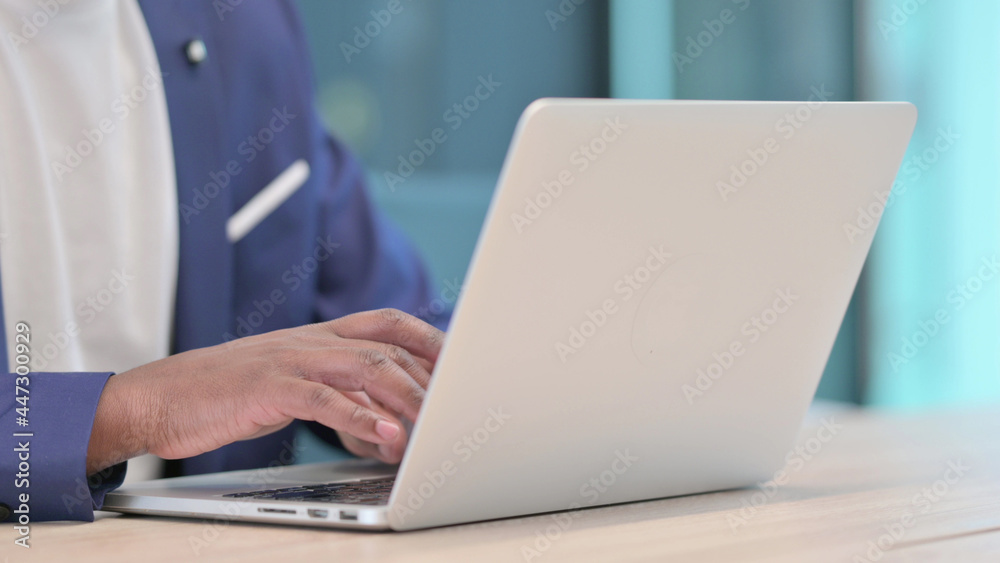 Hands Close up of Young African Businessman Typing on Laptop Hands Close up of Young African Businessman Typing on Laptop