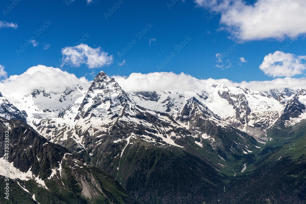 Great nature mountain landscapes. High mountains under snow. Scenic View Of Mountains Against Blue Sky.