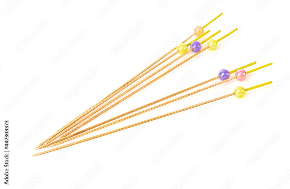 Bamboo wooden skewers with beads isolated on white background Bamboo wooden skewers with beads isolated on white background