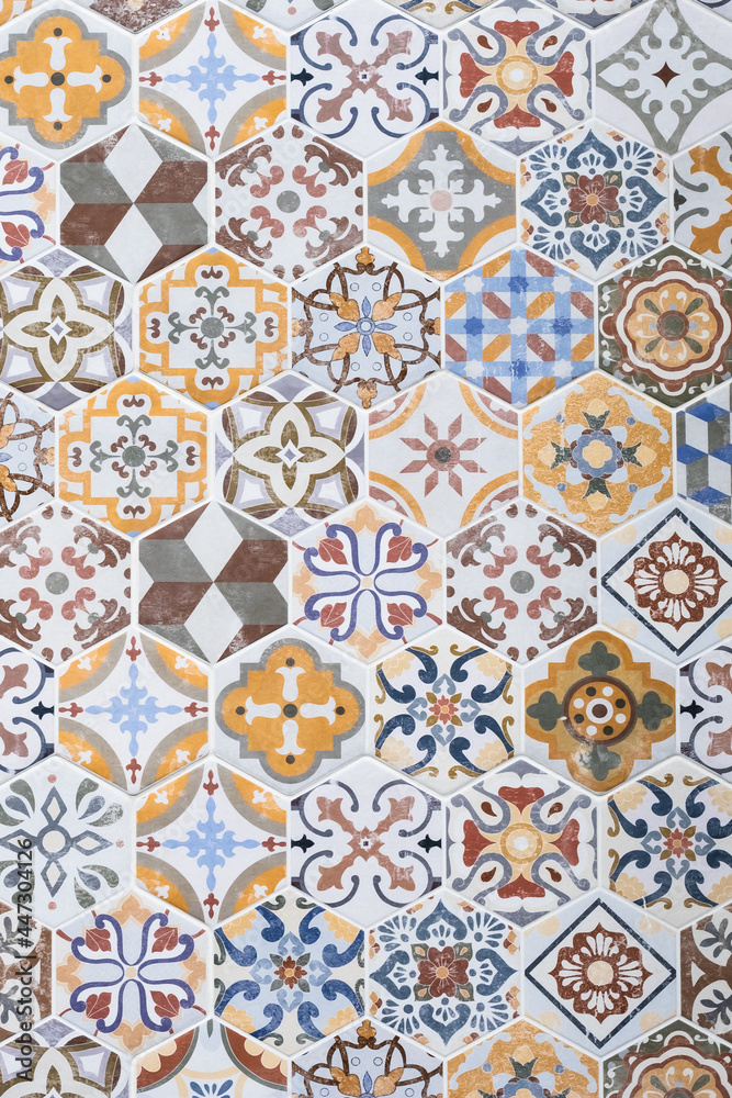Mosaic ceramic tile, colorful wall texture, abstract pattern, design element. Vintage tile background. Azulejo ornament, floor surface. Tiled backdrop. Wallpaper. Painted tin-glazed ceramic tilework.
