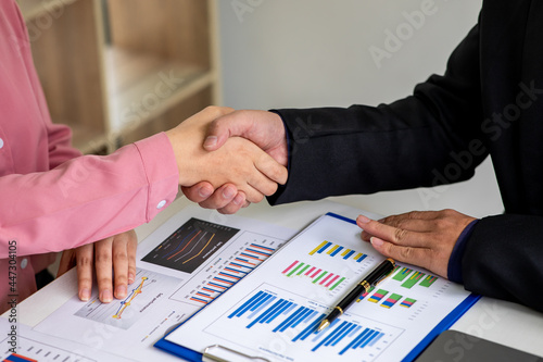 Close up of Business team analyzing income charts and graphs with modern laptop computer. Business analysis report and strategy concept.