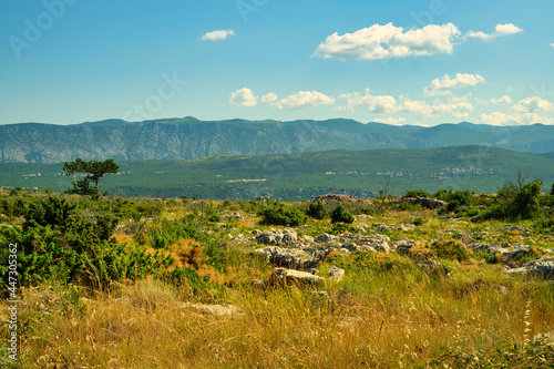 Beautiful trekking trail across the mountain valley to Biserujka cave on Croatia island Krk photo