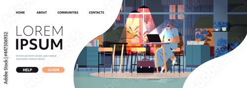 overworked arab businessman sitting at workplace business man freelancer looking in computer screen
