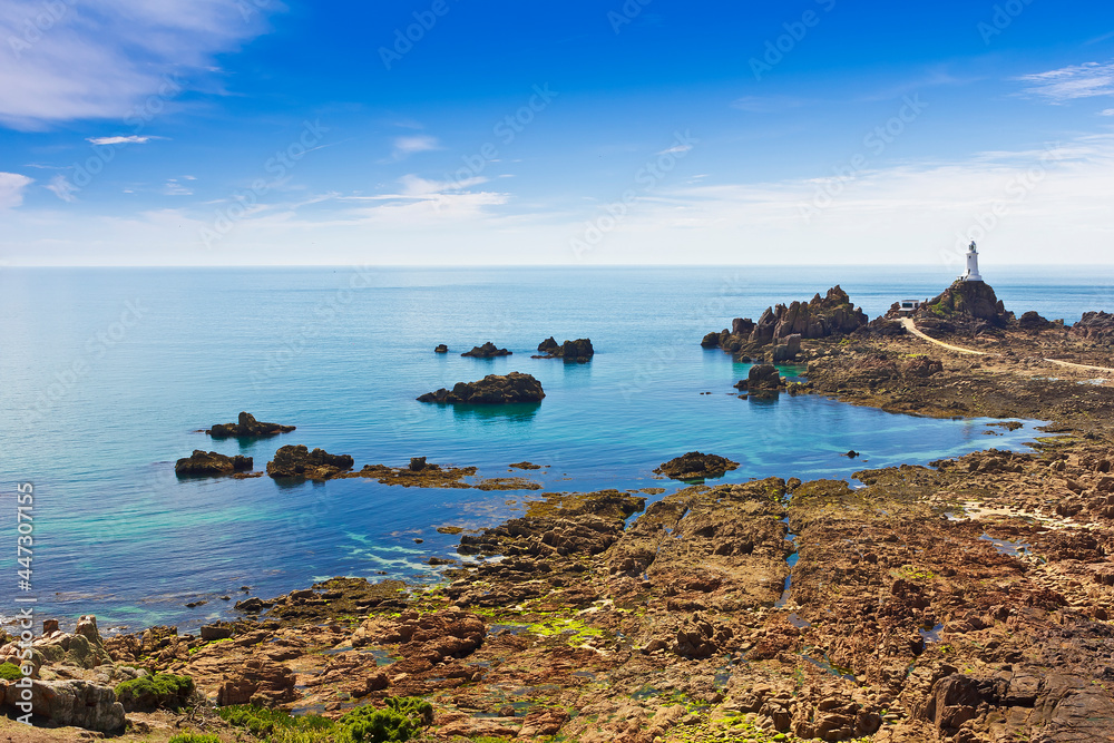 La Corbiere lighthouse on the south west corner of Jersey, Channel Islands, Britain, at low tide.