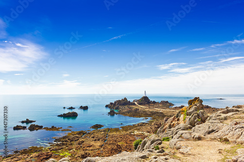 La Corbiere lighthouse on the south west corner of Jersey, Channel Islands, Britain, at low tide.