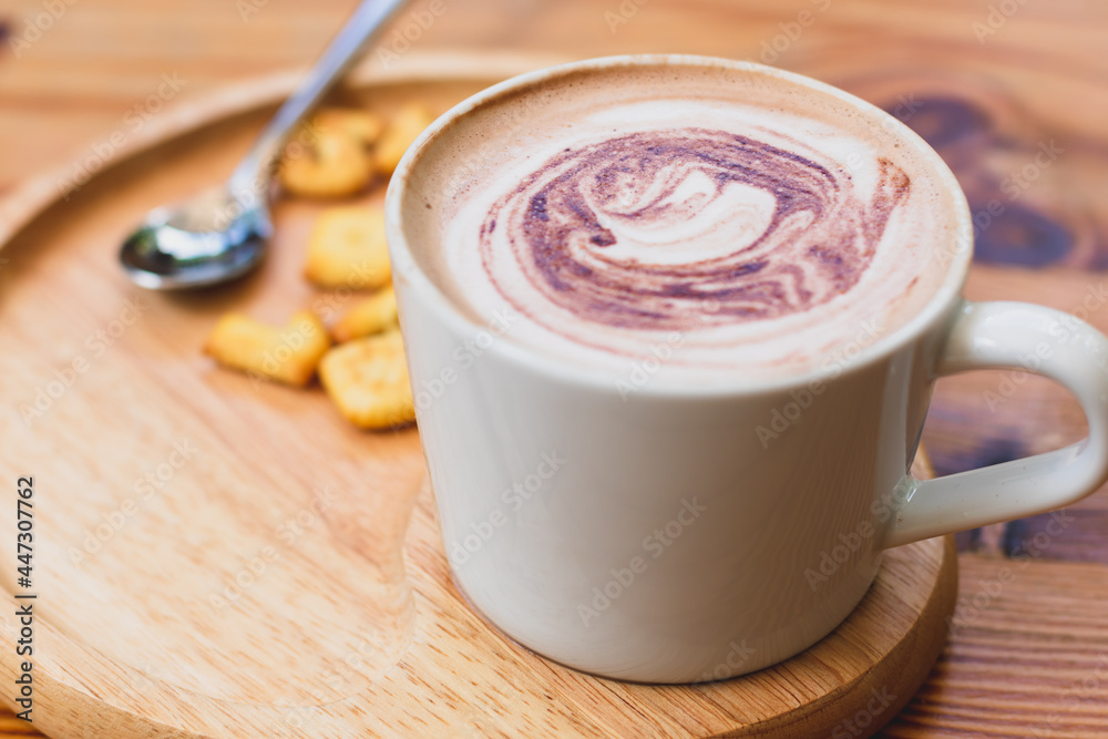 Cup of coffee and biscuit on wooden plate. Drink fresh daily. Cup of coffee and biscuit on wooden plate. Drink fresh daily.