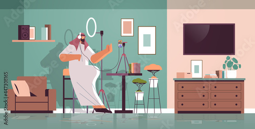 arab podcaster talking to microphone recording video blog in studio podcasting online radio broadcasting live streaming